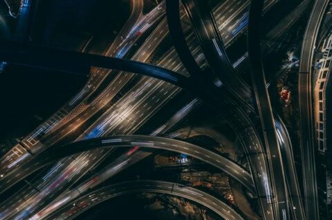 Birds eye view of several state highways interlinked to each other and cars plying on it in high speed